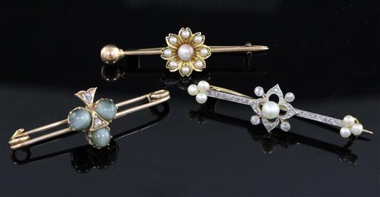 Three assorted Victorian gold and gem set bar brooches, largest approx. 49mm.